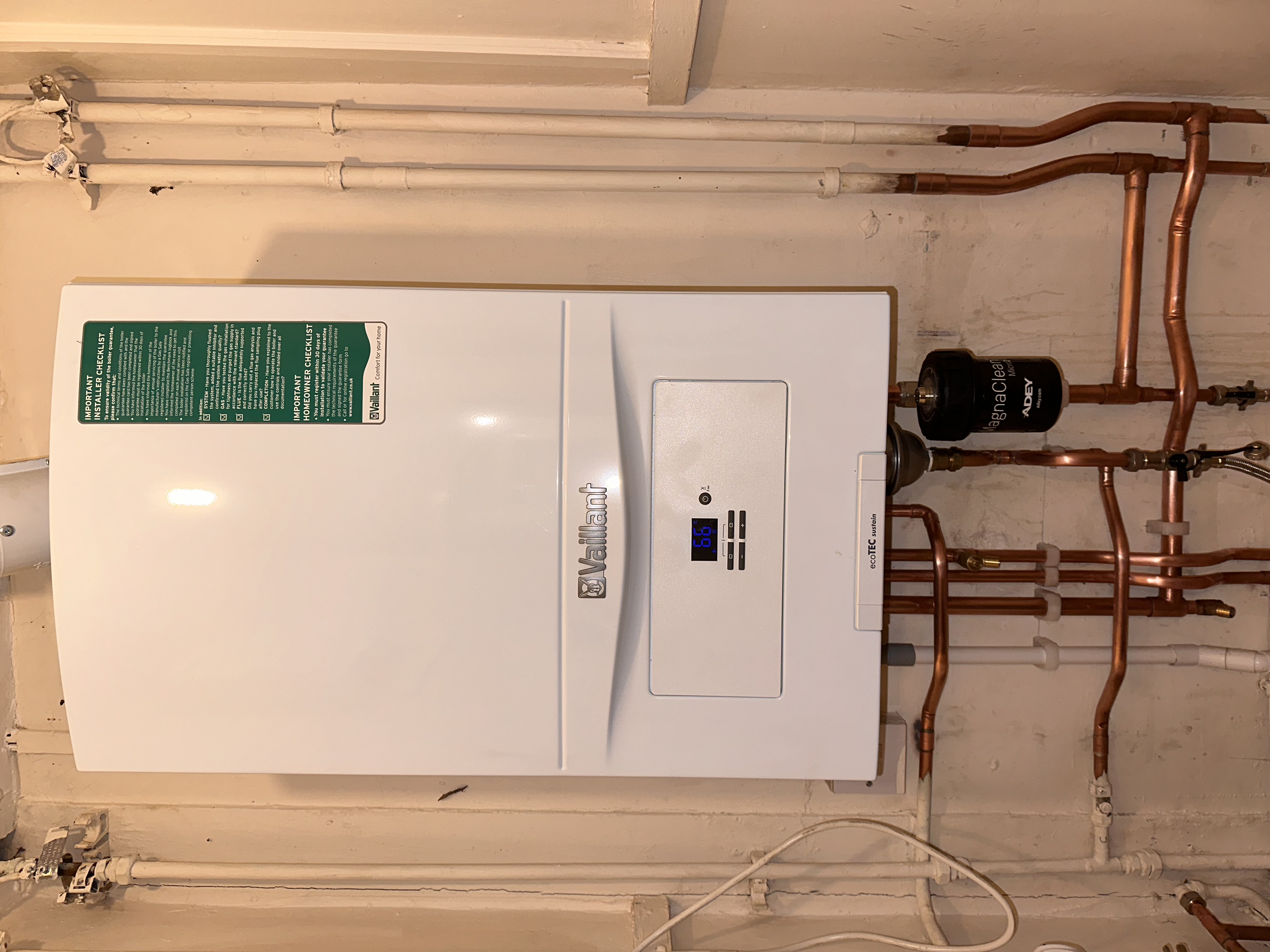 Domestic Vaillant boiler installation with tidy copper pipework by Pomona Eco Solutions