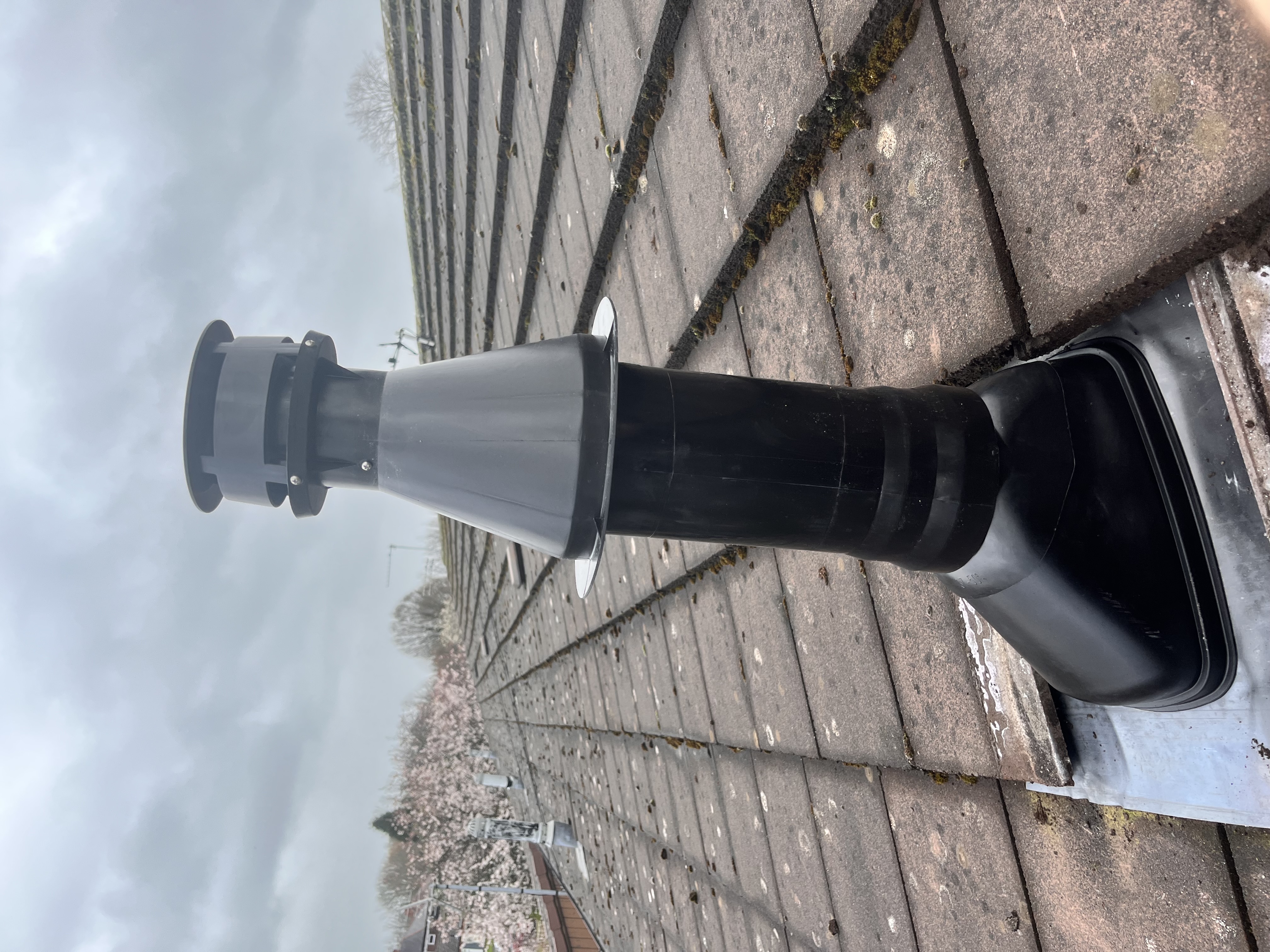 Boiler flue terminal installed on a roof by Pomona Eco Solutions