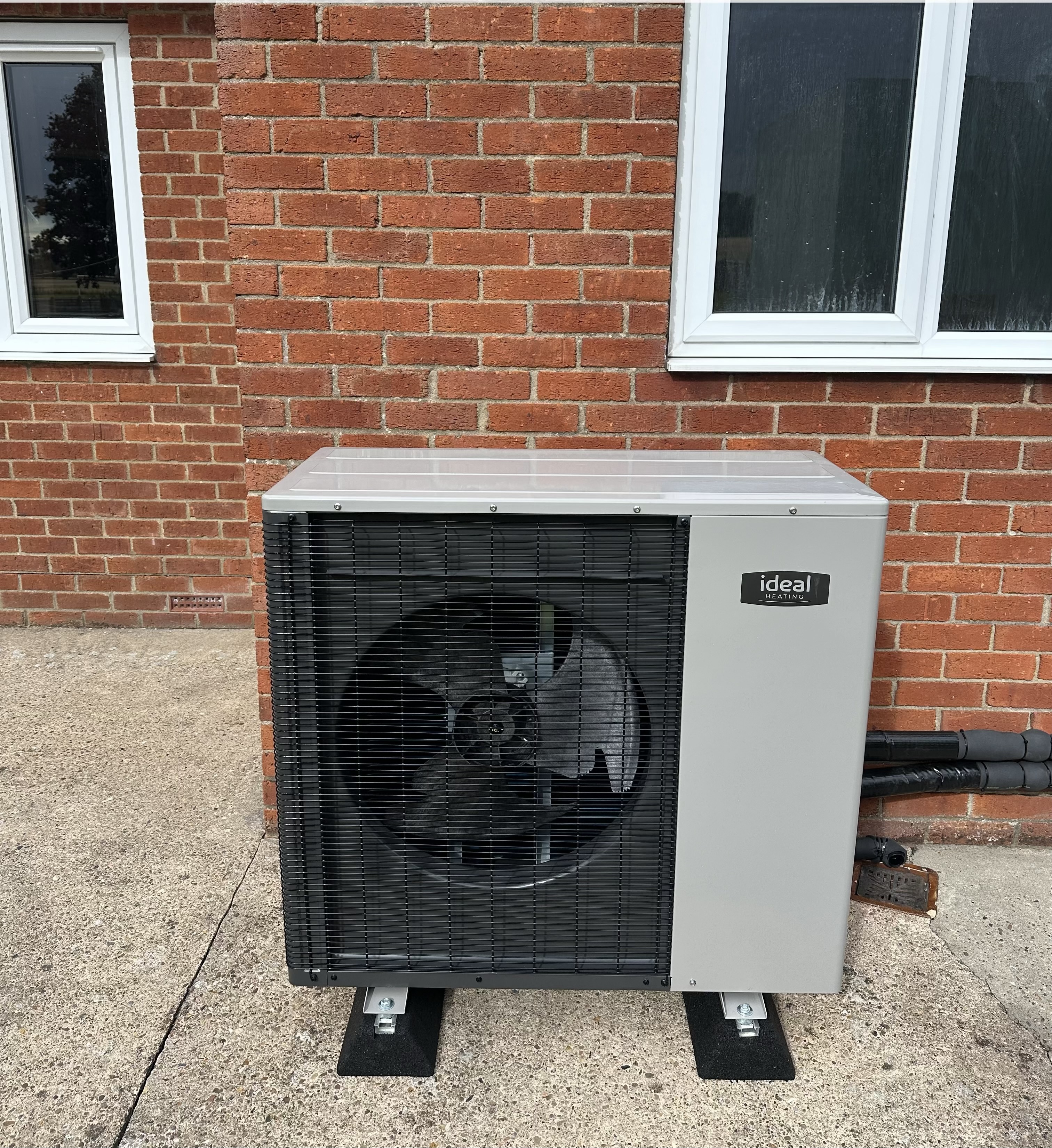 Air source heat pump installed by Pomona Eco Solutions outside a Merseyside property